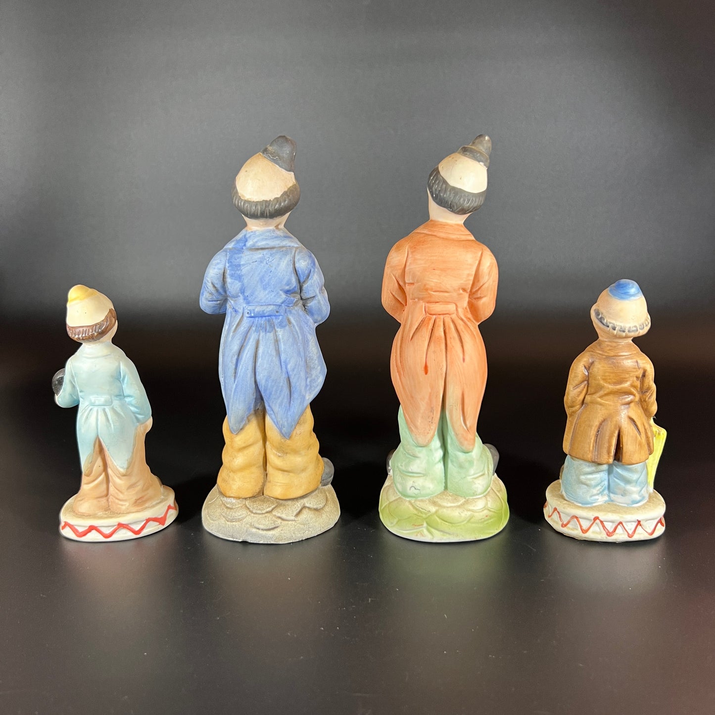 Vintage Set of 4 Hand-Painted Porcelain Clown Figurines