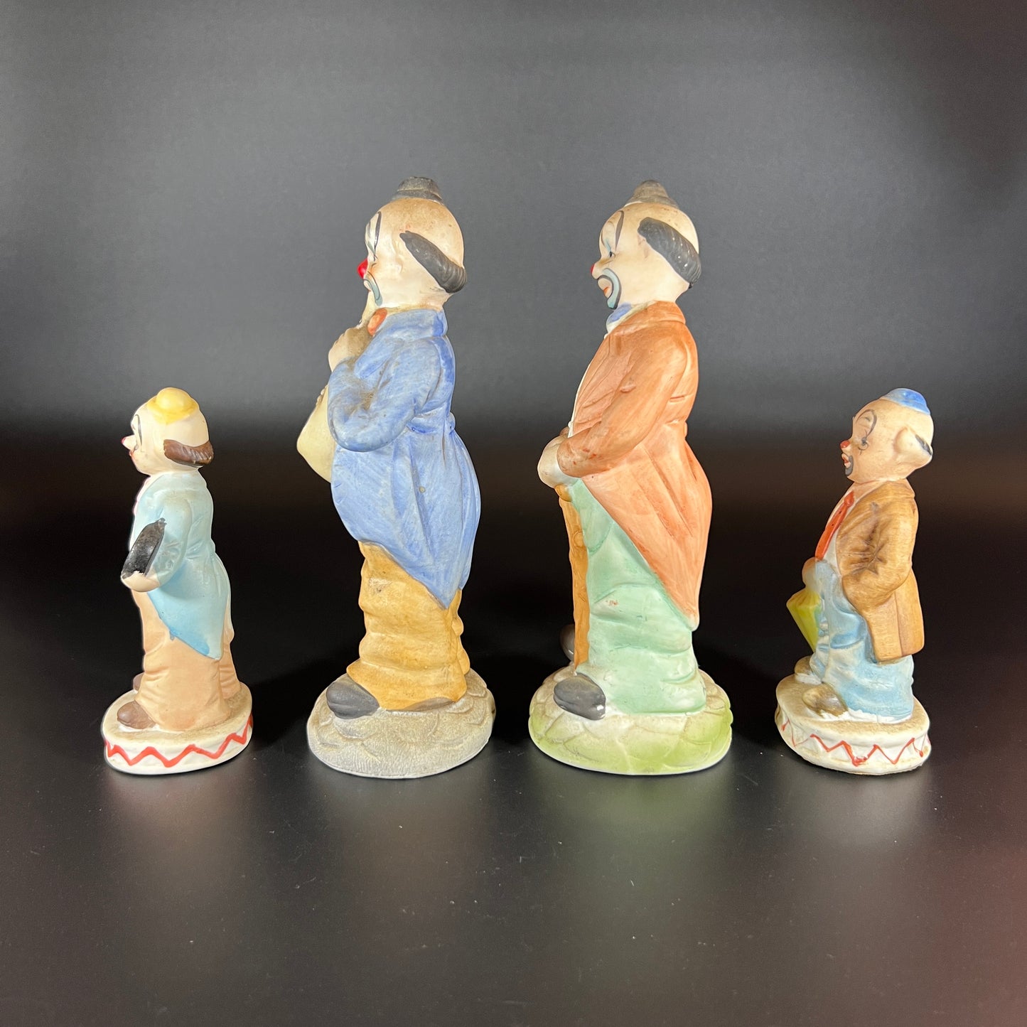 Vintage Set of 4 Hand-Painted Porcelain Clown Figurines
