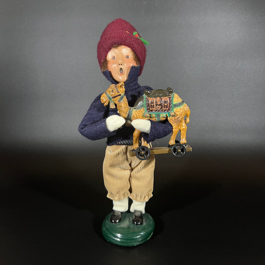 Byers Choice Doll - Boy with Toy Camel and Red Hat