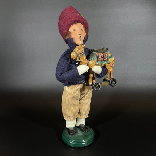 Byers Choice Doll - Boy with Toy Camel and Red Hat