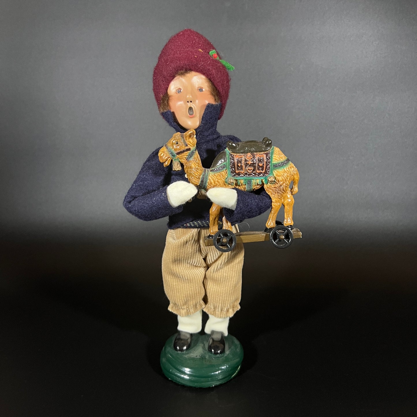 Byers Choice Doll - Boy with Toy Camel and Red Hat