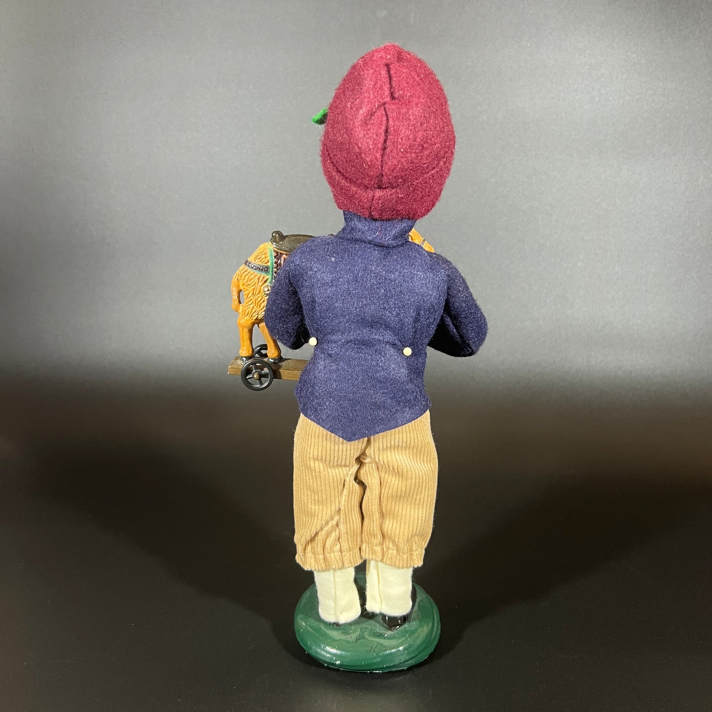 Byers Choice Doll - Boy with Toy Camel and Red Hat