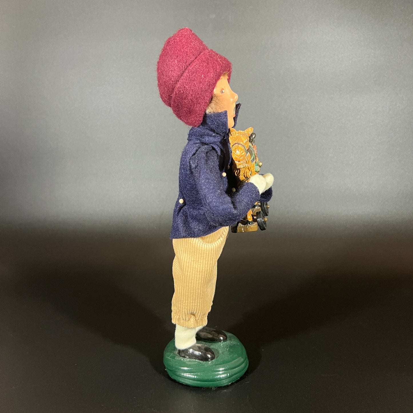 Byers Choice Doll - Boy with Toy Camel and Red Hat