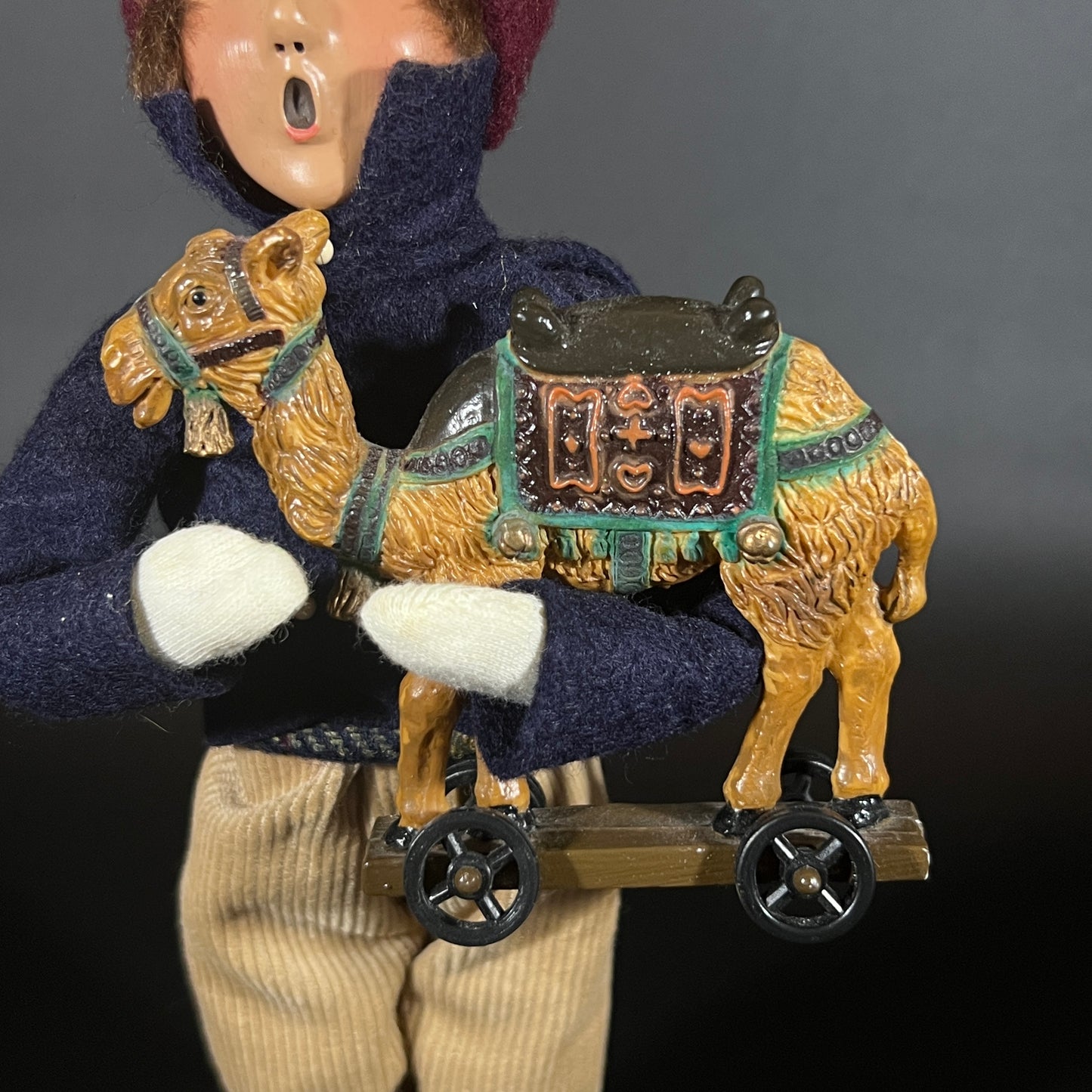 Byers Choice Doll - Boy with Toy Camel and Red Hat